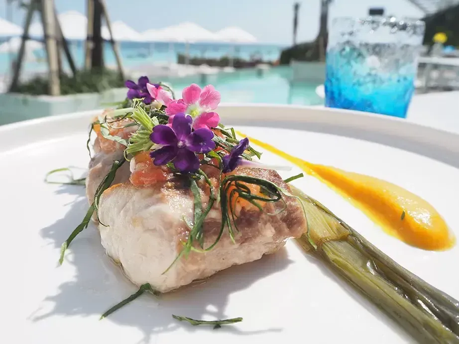 Steamed fish with edible flowers at Azure Beach Club