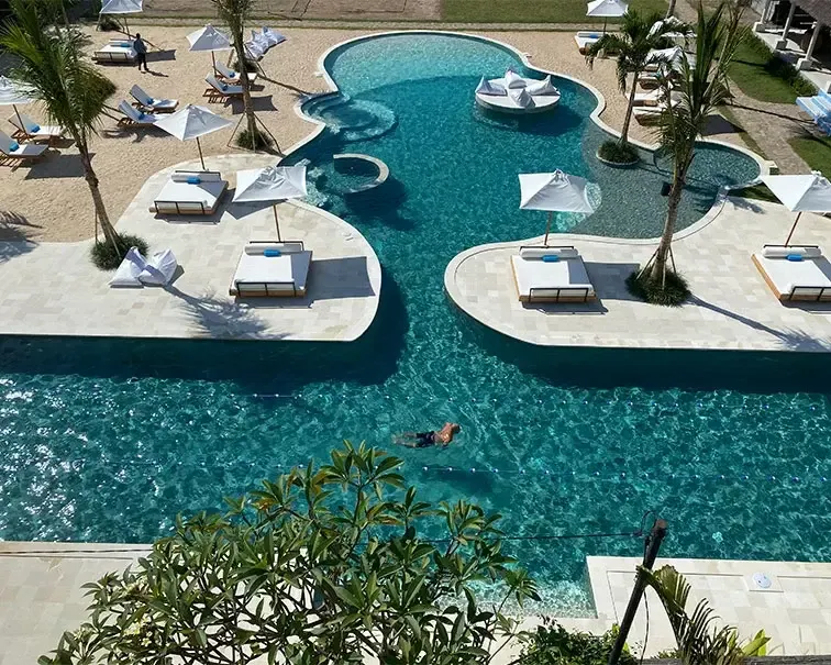 Aerial view of the lagoon pool and daybeds at Pronoia