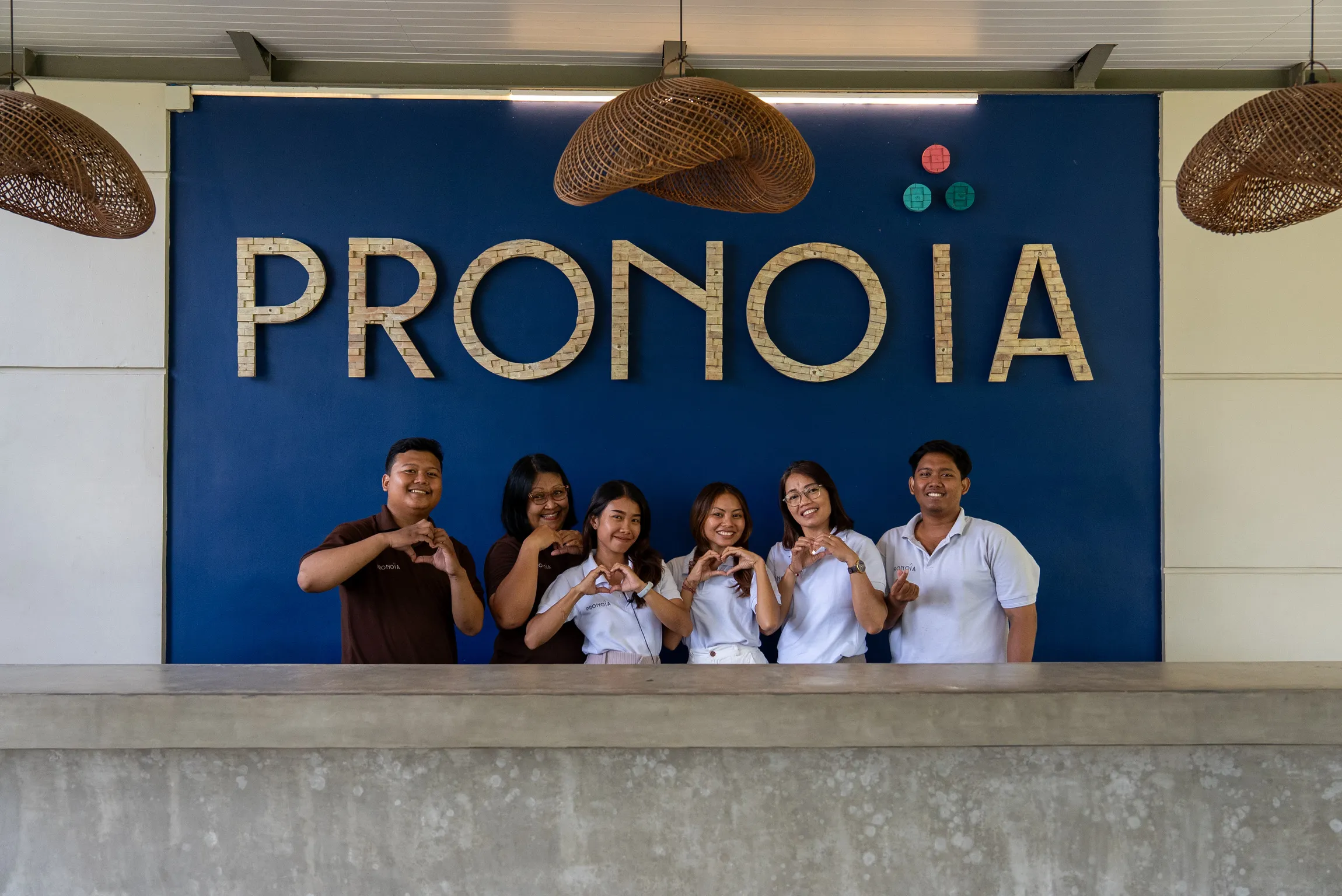 Pronoia concierge team at the branded reception desk