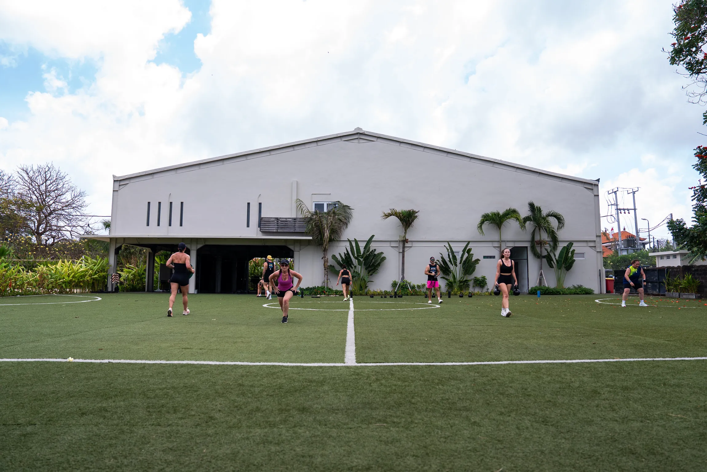 Group fitness training on the outdoor field at Pronoia